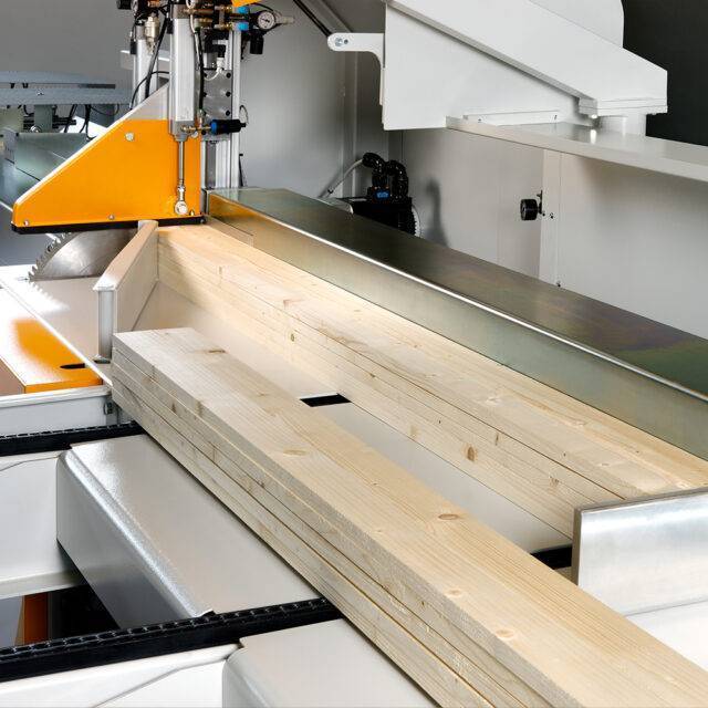 Salvador pushing stacked timber